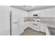 Efficient kitchen design with white cabinets, basic appliances, and functional layout at 6284 Anticline Ave, Las Vegas, NV 89139