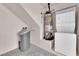 Bright laundry room with water softener system, water heater, and stacked washer and dryer at 6284 Anticline Ave, Las Vegas, NV 89139