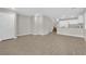 Spacious living room featuring stylish wood-look tile flooring and neutral wall paint at 6284 Anticline Ave, Las Vegas, NV 89139