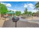 Community picnic area featuring picnic tables, barbecues, and playground equipment at 6284 Anticline Ave, Las Vegas, NV 89139