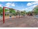 A fun community playground with swings and slides for and relaxing benches at 6284 Anticline Ave, Las Vegas, NV 89139