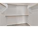 Spacious walk-in closet featuring wooden rods and shelving at 6284 Anticline Ave, Las Vegas, NV 89139