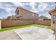 Expansive backyard with artificial turf, concrete patio, and modern landscaping elements for outdoor living at 6387 Azurelyn Ave, Las Vegas, NV 89122