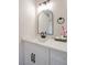 Modern bathroom with single vanity, black hardware and light countertop at 6387 Azurelyn Ave, Las Vegas, NV 89122