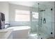 Bathroom featuring freestanding tub, glass shower, and modern finishes at 6387 Azurelyn Ave, Las Vegas, NV 89122