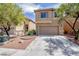 Two-story home boasting a neutral facade, attached garage, and well-kept front yard at 6387 Azurelyn Ave, Las Vegas, NV 89122