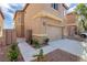 Charming two-story home with a neutral exterior, private gate, and low-maintenance landscaping at 6387 Azurelyn Ave, Las Vegas, NV 89122