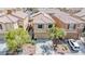 Charming two-story home with a well-maintained front yard, mature trees, and a cozy neighborhood setting at 6387 Azurelyn Ave, Las Vegas, NV 89122