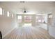 Bright, open living space with natural light, hardwood flooring, and sliding door access to the yard at 6387 Azurelyn Ave, Las Vegas, NV 89122