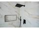Close up of modern shower featuring marble tile and black hardware at 6387 Azurelyn Ave, Las Vegas, NV 89122