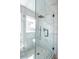 Shower featuring marble tile, black hardware, and glass surround at 6387 Azurelyn Ave, Las Vegas, NV 89122