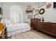 Comfortable bedroom with a bright shuttered window and unique decor at 6688 Martinsville Pl, Las Vegas, NV 89110
