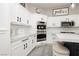 Bright kitchen features custom cabinets and stainless steel appliances at 6688 Martinsville Pl, Las Vegas, NV 89110