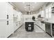 Bright kitchen features custom cabinets, an island, and stainless steel appliances at 6688 Martinsville Pl, Las Vegas, NV 89110