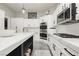 Bright kitchen features custom cabinets, an island, and stainless steel appliances at 6688 Martinsville Pl, Las Vegas, NV 89110
