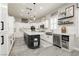 Bright kitchen features custom cabinets, an island, and stainless steel appliances at 6688 Martinsville Pl, Las Vegas, NV 89110