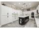 Bright kitchen features custom cabinets, an island, and stainless steel appliances at 6688 Martinsville Pl, Las Vegas, NV 89110