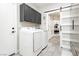 Spacious laundry room features plenty of counter space, storage, and modern appliances at 6688 Martinsville Pl, Las Vegas, NV 89110