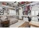 Relaxing living room featuring a gray sectional sofa, warm decor, and sports memorabilia at 6688 Martinsville Pl, Las Vegas, NV 89110