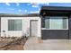 Single story home with a mix of white and black brick exterior and easy to maintain gravel landscaping at 704 Slayton Dr, Las Vegas, NV 89107