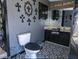 Gothic bathroom with patterned flooring and decorative cross wall art at 709 Evergreen Cir, Las Vegas, NV 89107