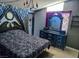 Gothic bedroom featuring dark accents and a black and grey patterned bedspread at 709 Evergreen Cir, Las Vegas, NV 89107