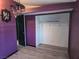 Bedroom featuring a black closet and lilac colored walls with white trim at 709 Evergreen Cir, Las Vegas, NV 89107