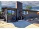 Unique single story home with a brick chimney, concrete walkway, and decorative plants by the front door at 709 Evergreen Cir, Las Vegas, NV 89107