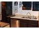 This kitchen features stainless steel appliances, black cabinets, and a double basin sink at 709 Evergreen Cir, Las Vegas, NV 89107