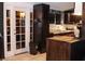 Kitchen area featuring black cabinets, stainless steel appliances, and glass paneled back door at 709 Evergreen Cir, Las Vegas, NV 89107