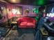 Stylish living room with gothic decor, a red sofa, and elegant, dark aesthetic at 709 Evergreen Cir, Las Vegas, NV 89107