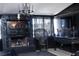 View of the living room with dark walls, fireplace, chandelier and unique gothic style decor at 709 Evergreen Cir, Las Vegas, NV 89107