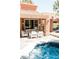 Charming backyard oasis featuring a private spa, outdoor seating area, and stylish tile work at 7607 Boca Raton Dr, Las Vegas, NV 89113