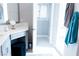 Inviting bathroom featuring vanity, vanity stool, and a doorway to a closet at 7607 Boca Raton Dr, Las Vegas, NV 89113