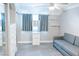 Cozy bedroom showcases a pull-out couch, built-in storage, and a window with natural light at 7607 Boca Raton Dr, Las Vegas, NV 89113