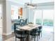Open concept dining area with sliding doors and view of the kitchen, ideal for entertaining at 7607 Boca Raton Dr, Las Vegas, NV 89113