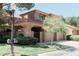 Inviting two-story home featuring a well-maintained front yard and a charming tiled roof at 7607 Boca Raton Dr, Las Vegas, NV 89113