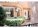 Charming front entrance with a white door, sidelight, and well-maintained landscaping at 7607 Boca Raton Dr, Las Vegas, NV 89113