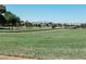 Scenic golf course view with lush green fairways, mature trees, and a tranquil setting at 7607 Boca Raton Dr, Las Vegas, NV 89113