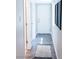 Bright hallway features wood-look flooring, neutral walls, and stylish decor, creating a welcoming transition space at 7607 Boca Raton Dr, Las Vegas, NV 89113