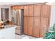 Kitchen boasts ample cabinet space, stainless steel refrigerator, and island at 7607 Boca Raton Dr, Las Vegas, NV 89113