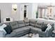Spacious living room area with modern sectional couch at 7607 Boca Raton Dr, Las Vegas, NV 89113
