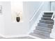Elegant staircase featuring plush carpet and decorative niche, adding a touch of sophistication at 7607 Boca Raton Dr, Las Vegas, NV 89113