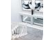 Stylish staircase features white railing, carpeted steps, and decorative wall art at 7607 Boca Raton Dr, Las Vegas, NV 89113