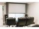 Home theater features comfortable leather seating and a large projector screen at 7607 Boca Raton Dr, Las Vegas, NV 89113