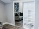 Mirrored closet doors reflect a grey velvet sofa and well-organized, spacious storage solutions at 7607 Boca Raton Dr, Las Vegas, NV 89113
