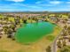 Beautiful aerial view showcasing a lush golf course and serene lake in a residential area at 7669 Fieldfare Dr, North Las Vegas, NV 89084