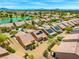 Aerial view of homes featuring desert landscaping, solar panels, and tile roofs in a serene community at 7669 Fieldfare Dr, North Las Vegas, NV 89084
