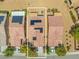 Aerial view of several homes featuring a private backyard, solar panels, and desert landscaping at 7669 Fieldfare Dr, North Las Vegas, NV 89084