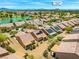 Picturesque aerial view of a desert community highlighting landscaped yards, homes with solar panels and proximity to green spaces at 7669 Fieldfare Dr, North Las Vegas, NV 89084